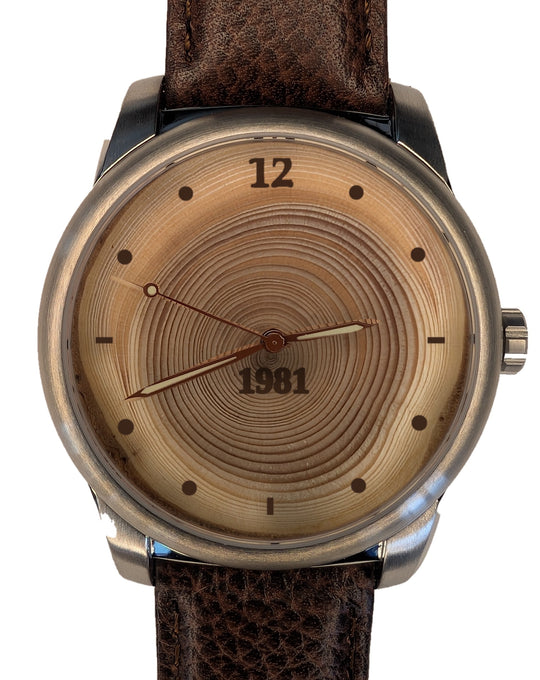 Wood watch with 45 tree rings, origin year 1981 burned on the dial