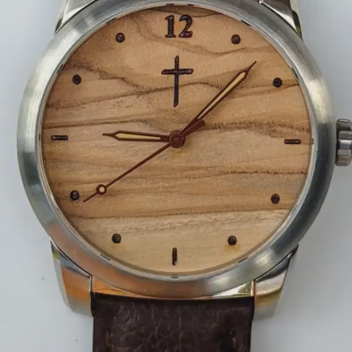 Watch face made from Bethlehem olivewood with cross design and brown leather strap, perfect for memorial personalization.