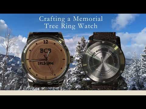 Memorial tree ring watch showing custom engraving and a scenic outdoor background, crafted for remembrance.