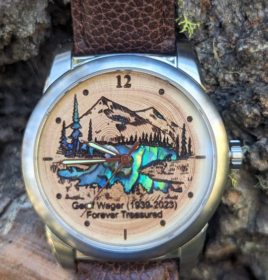 Tree Ring Urn Watch featuring Mother of Pearl inlay, engraved with a mountain scene and tribute.