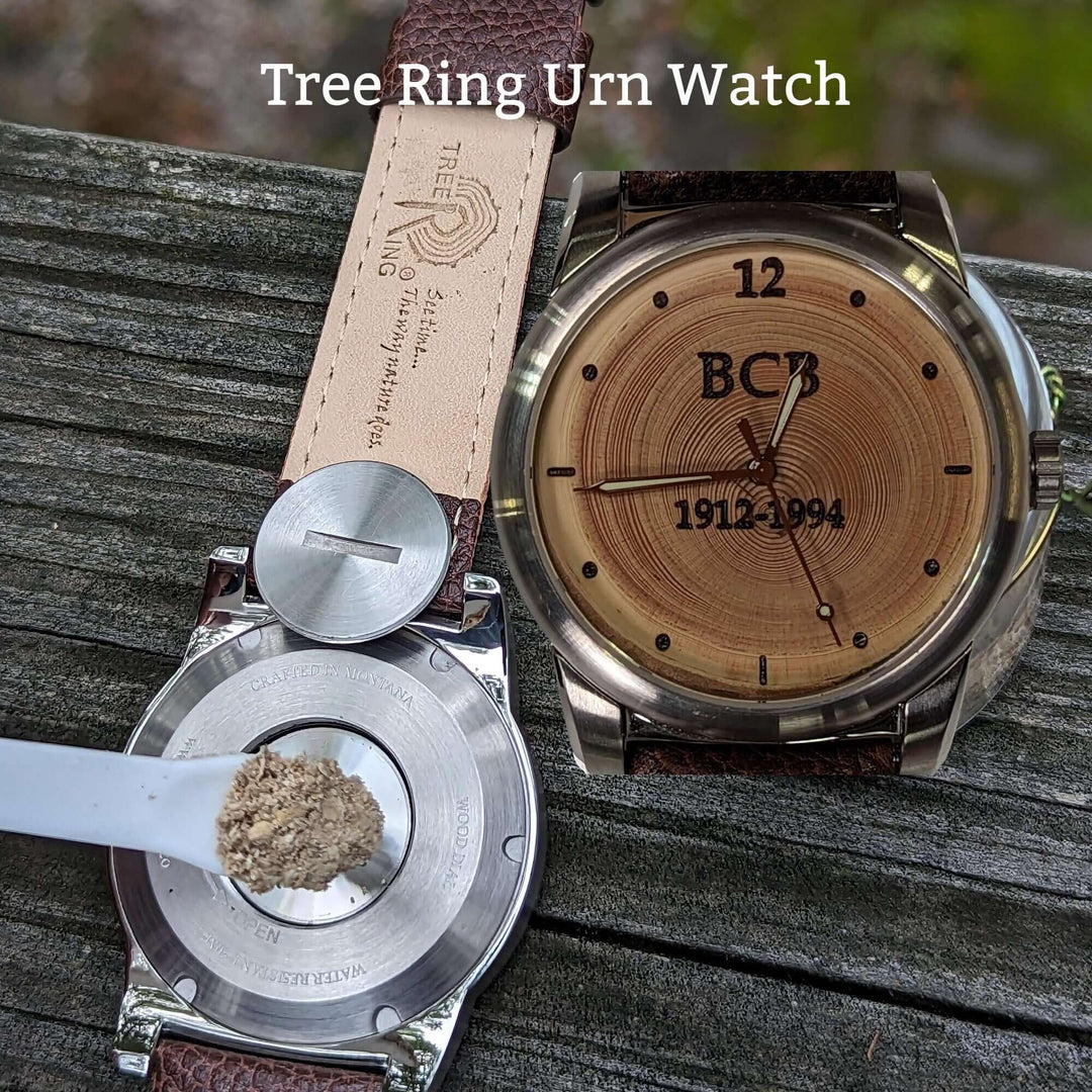 Tree Ring Urn Watch displaying engraved initials and tree ring texture, with compartment for cremation remains.